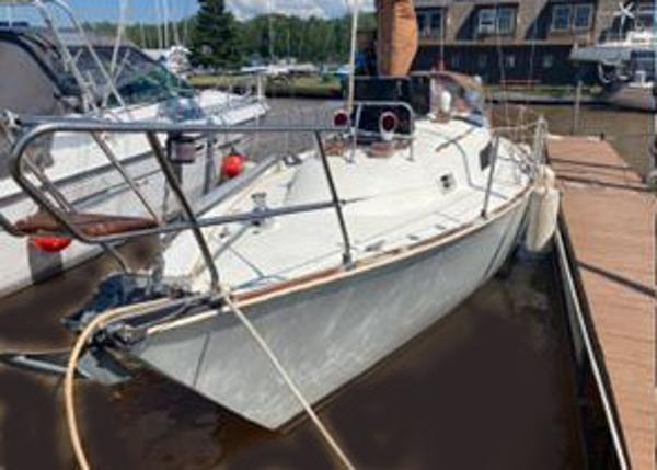 C&C Landfall 35 1981 C&C Landfall 35 sailboat docked at a marina, side view.