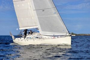 X-Yachts IMX-40 2001 X-Yachts IMX-40 sailing on open water under clear blue skies.