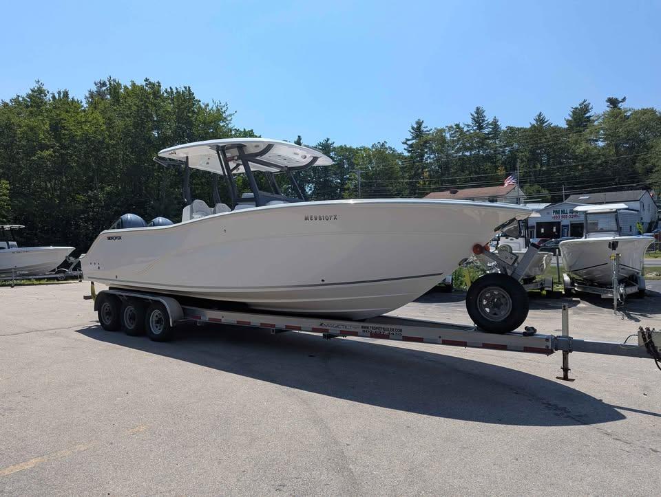 Sea Fox 288 Commander 2024 Sea Fox 288 Commander boat on a trailer, parked outdoors on a sunny day.