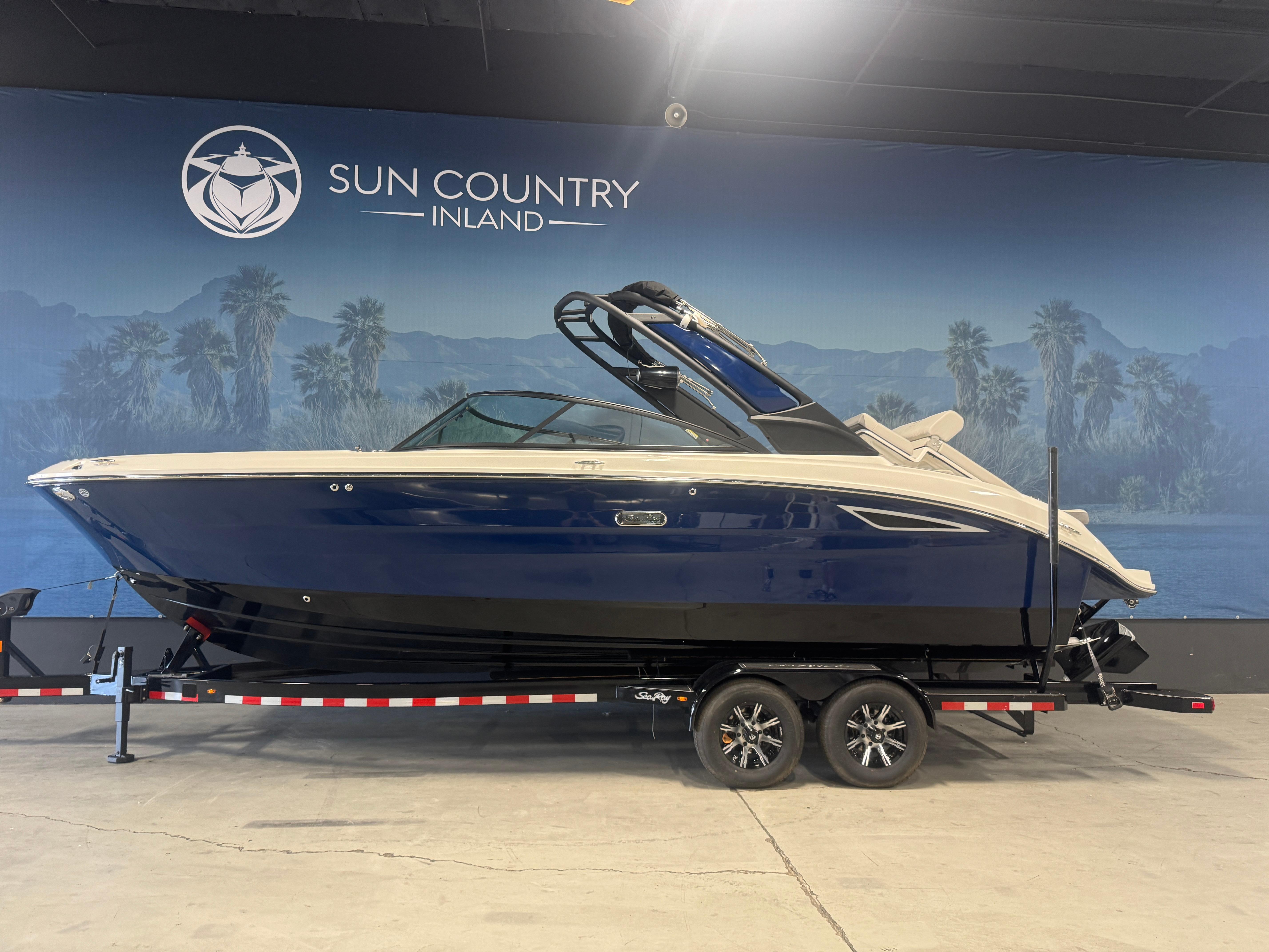 Sea Ray SDX 270 Surf 2026 Sea Ray SDX 270 Surf boat on trailer at Sun Country Inland showroom.
