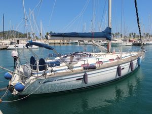 Bavaria Cruiser 46 2005 Bavaria 46 Cruiser sailboat docked in a sunny marina.