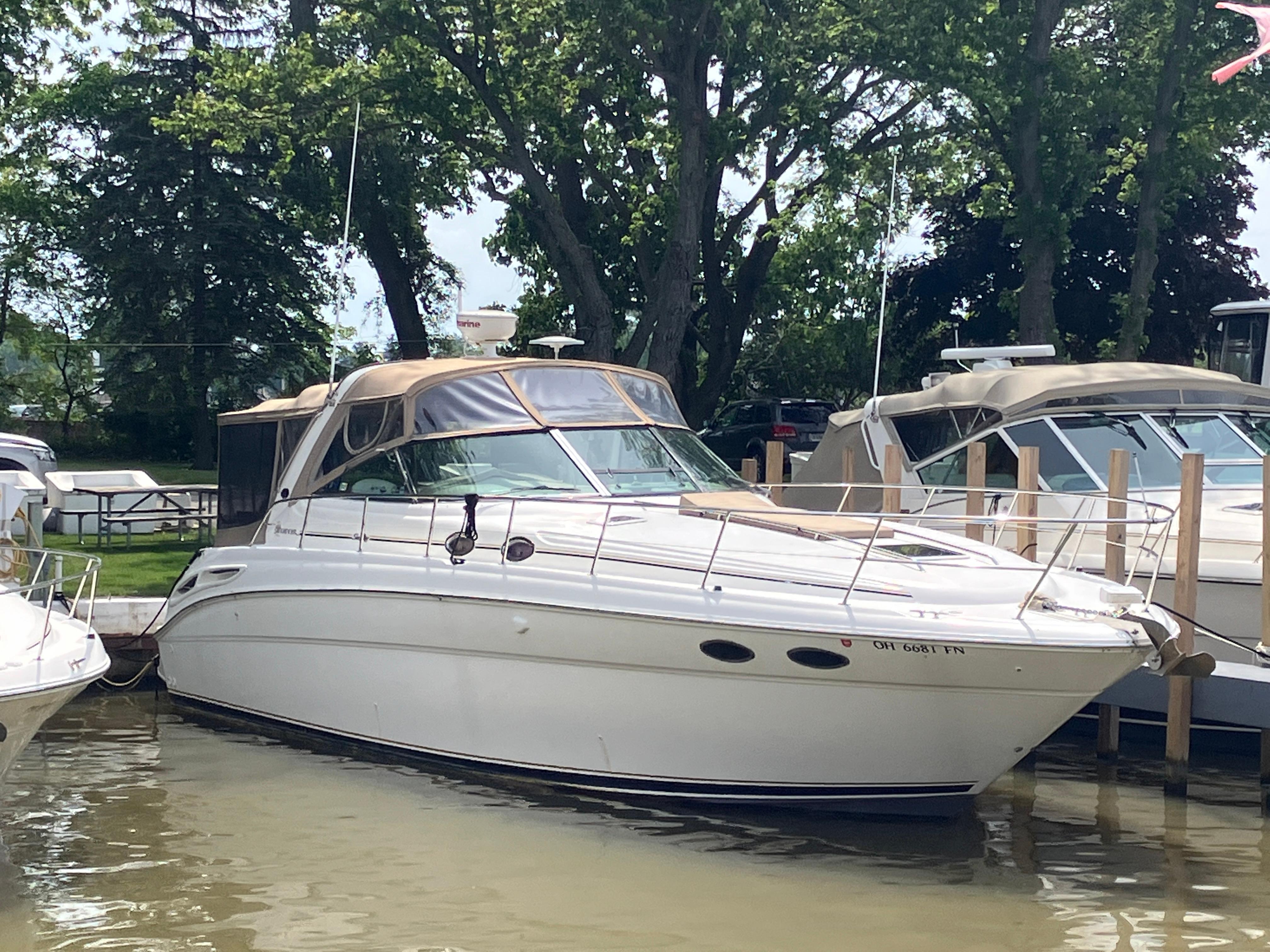 Sea Ray 380 Sundancer 2000 Sea Ray 380 Sundancer yacht docked in a marina, surrounded by trees.