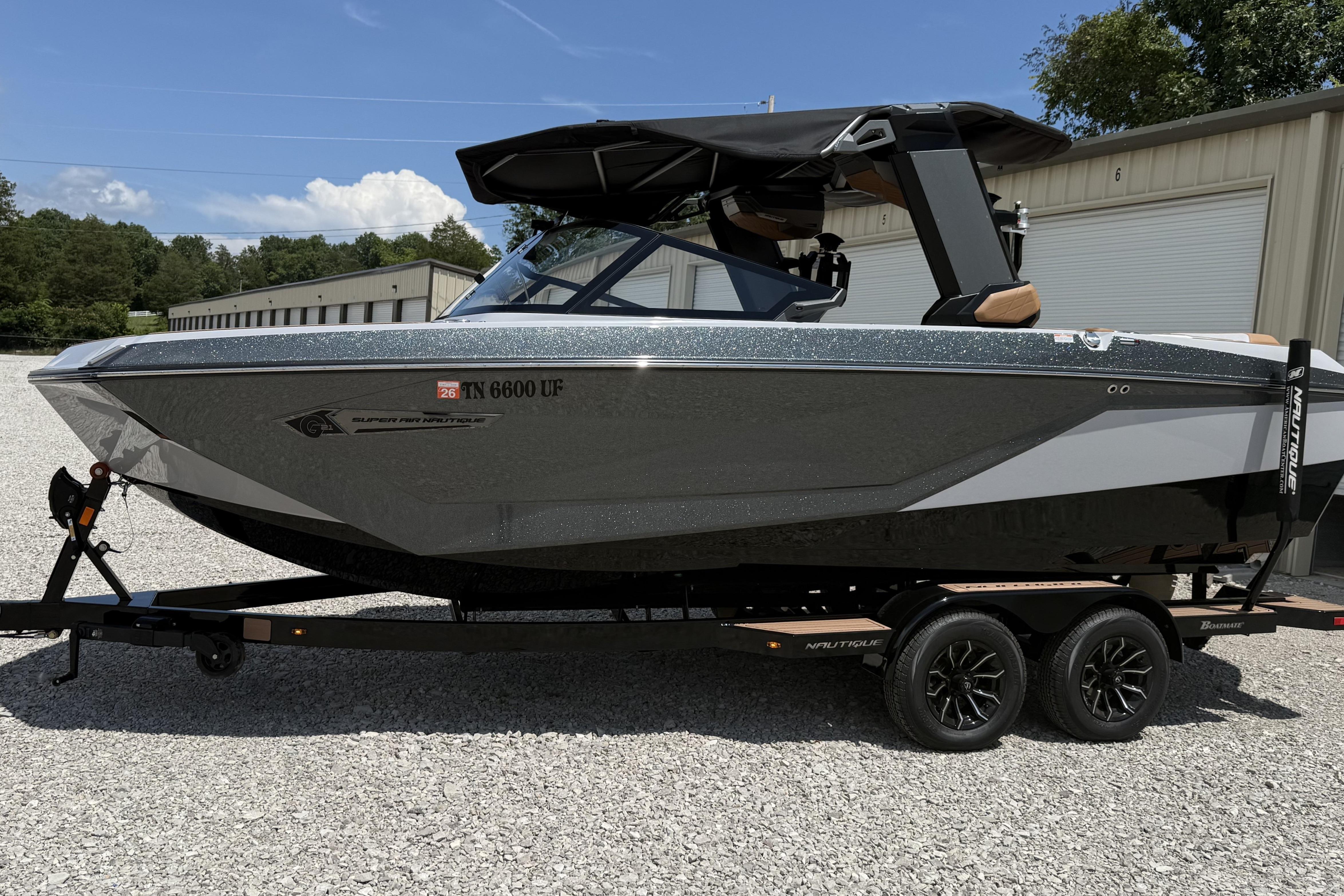 Nautique Super Air Nautique G21 2024 Nautique Super Air Nautique G21 boat on trailer, parked outdoors.