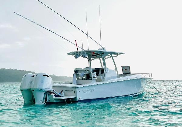Jupiter 32 Cuddy Cabin 2017 Jupiter 32 Cuddy Cabin boat on clear turquoise water.