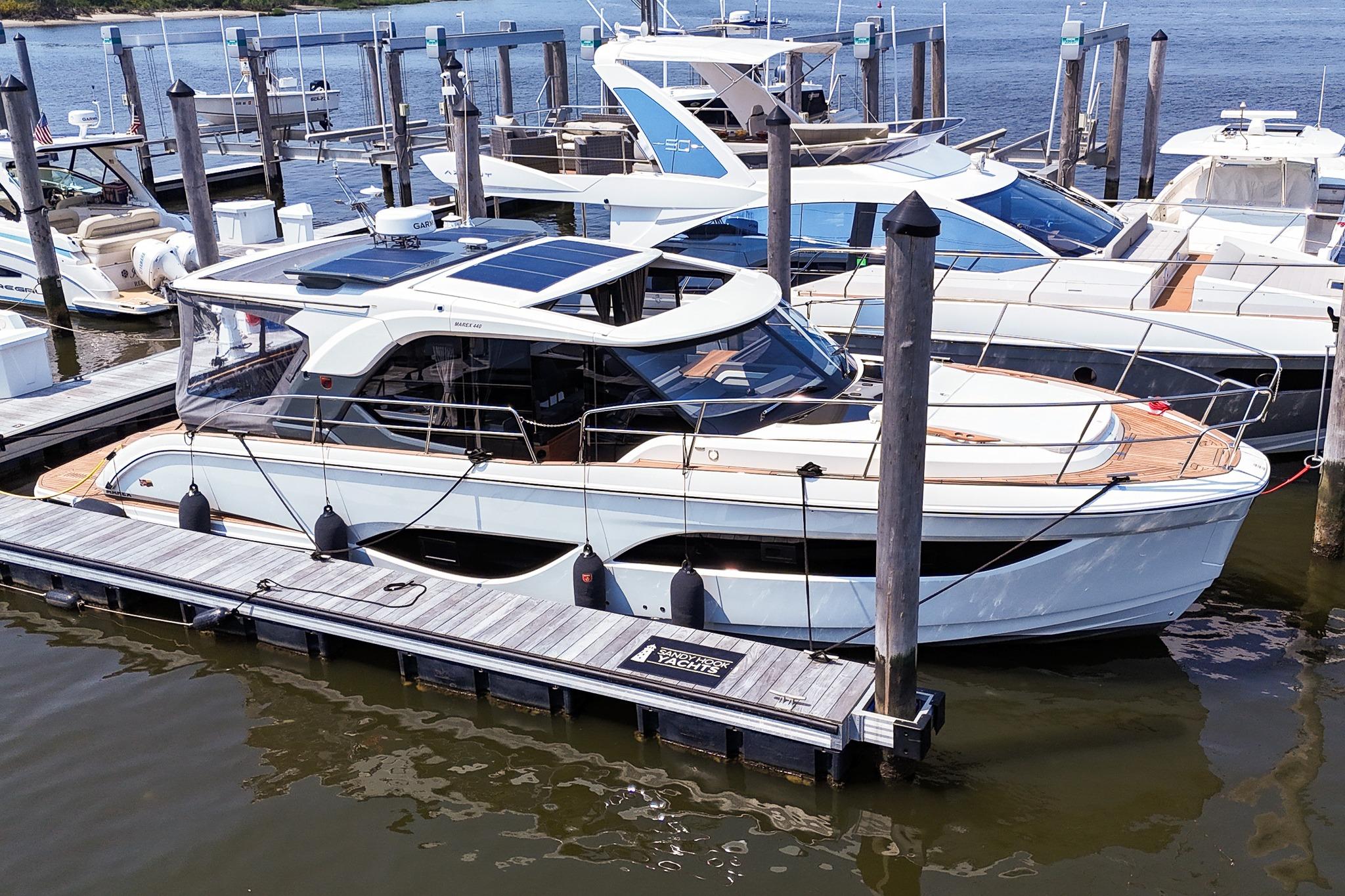 Marex 440 2026 Marex 440 yacht docked at marina, showcasing sleek design and modern features.