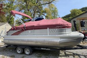 Bennington 20 LSB 2022 Bennington 20 LSB pontoon boat with red cover on trailer.