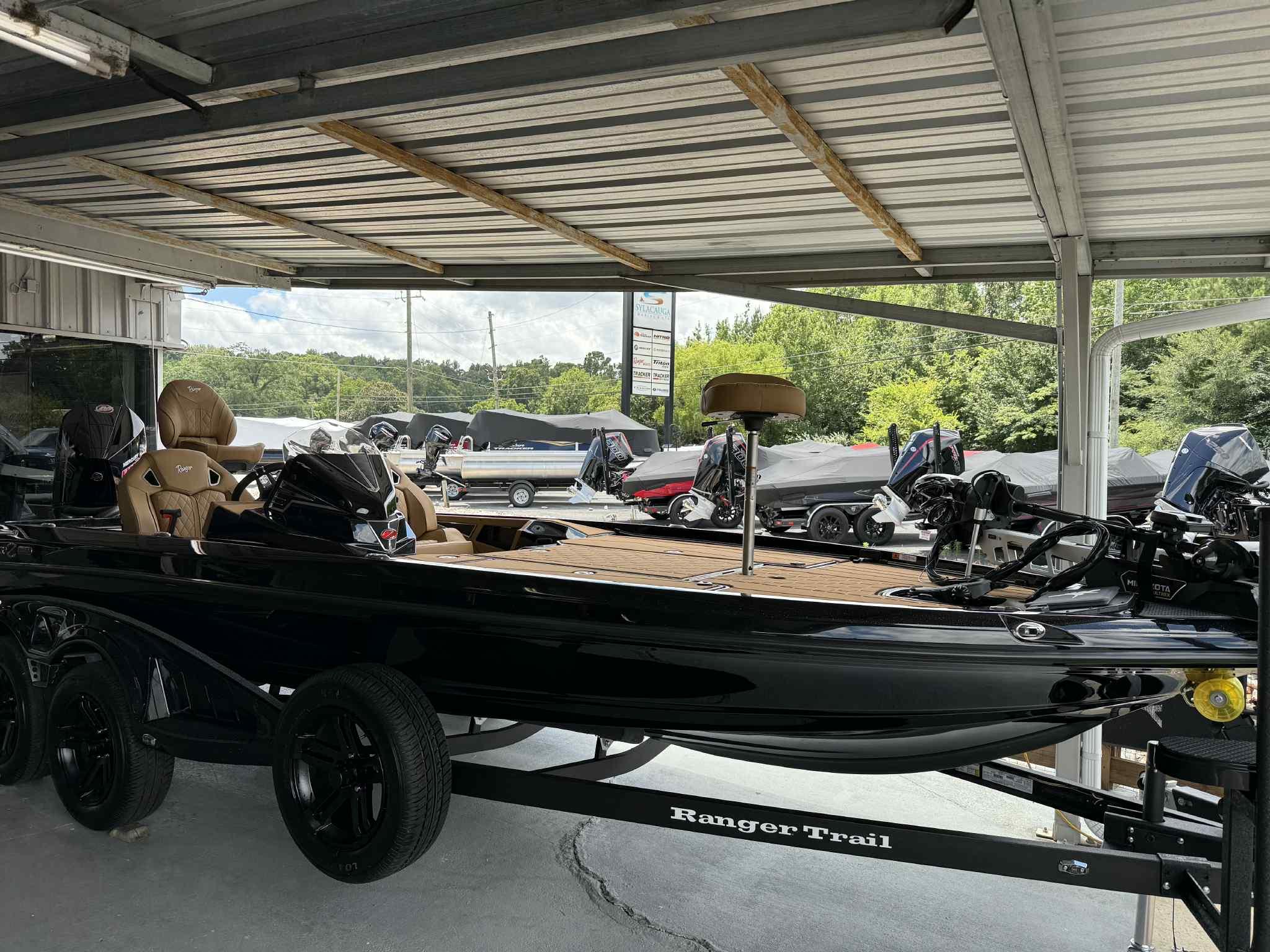Ranger Z520R Cup-Equipped 2025 Ranger Z520R Cup-Equipped boat on trailer under metal roof.
