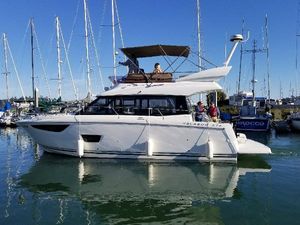 Jeanneau Velasco 37F 2016 Jeanneau Velasco 37F yacht docked in marina, clear blue sky.