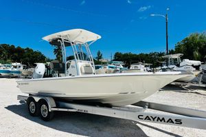 Key West 230 Bay Reef 2026 Key West 230 Bay Reef boat on trailer in sunny marina setting.