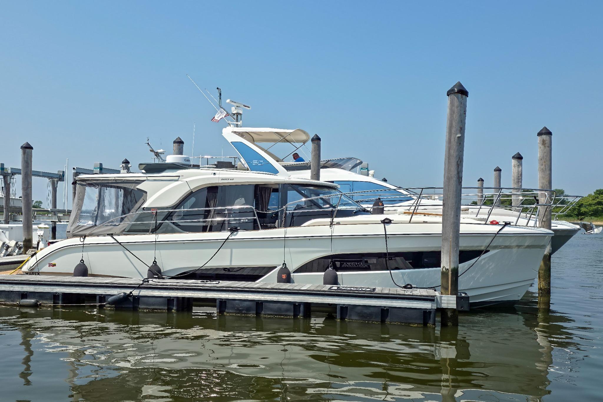 Marex 440 2026 Marex 440 yacht docked at marina on a sunny day.