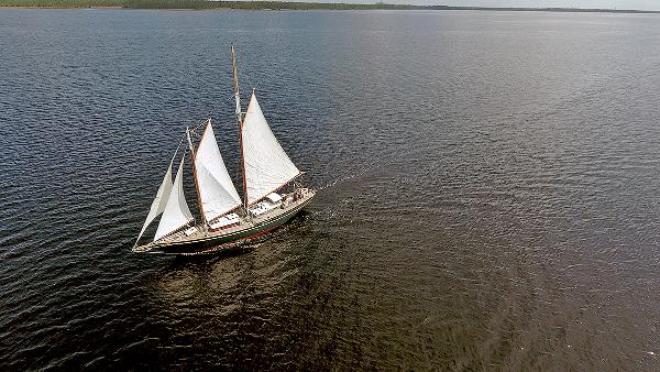 Custom Van Dyne Schooner Aerial view of 1979 Custom Van Dyne Schooner sailing on calm waters.