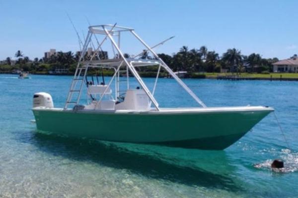 Robalo Caribbean 1974 Robalo Caribbean boat anchored in clear blue water.