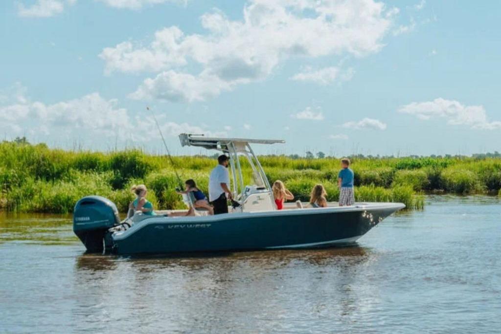 Key West 203 FS 2023 Key West 203 FS boat with people enjoying a sunny day on the water.