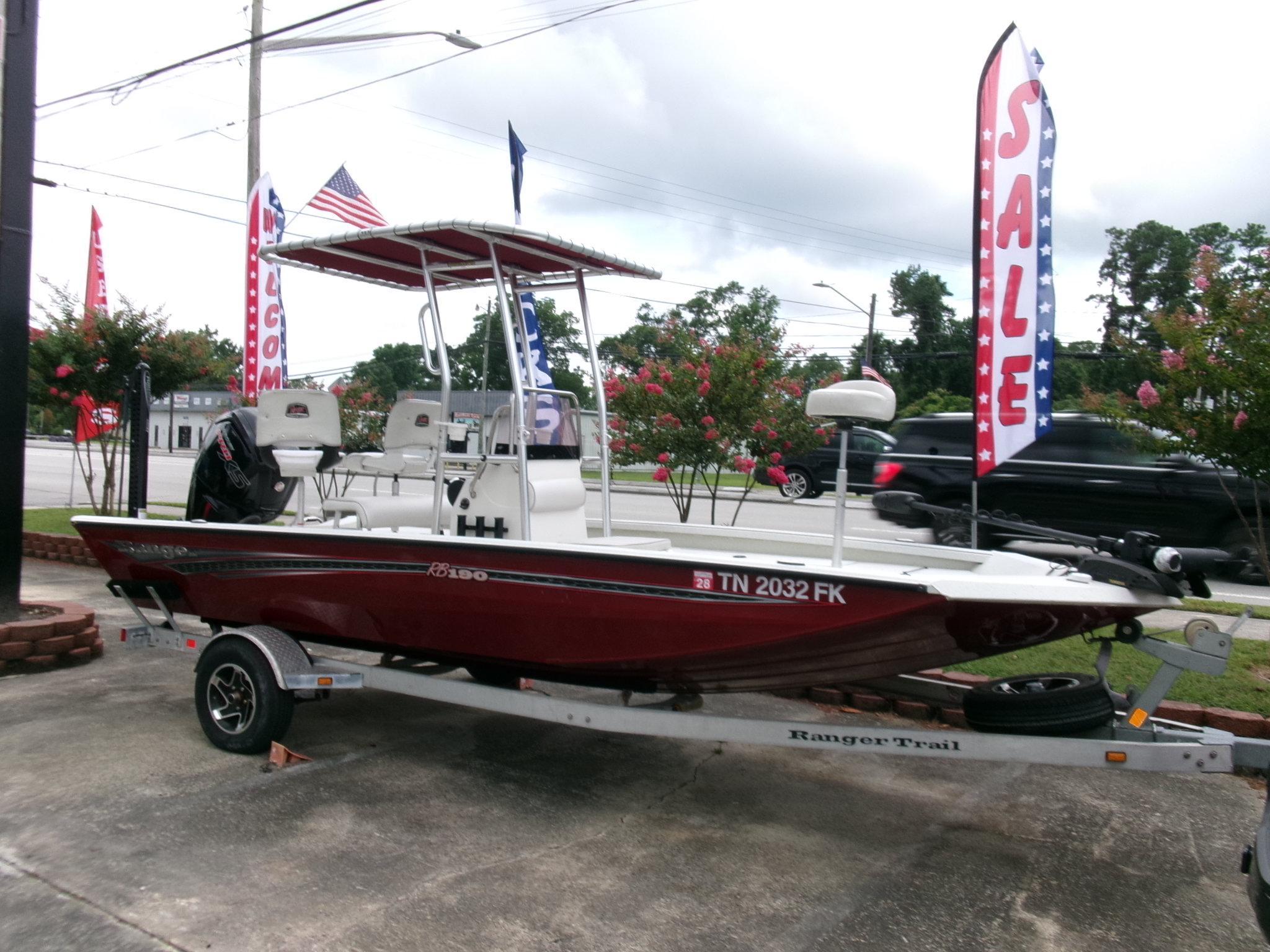 Ranger RB190 2020 Ranger RB190 boat on trailer, displayed for sale with flags in background.