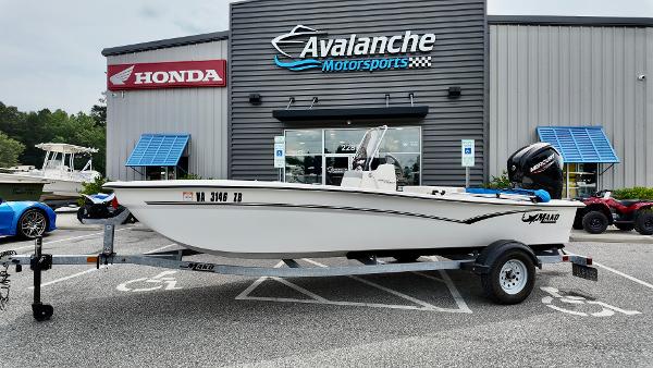 Mako Pro Skiff 17 2023 Mako Pro Skiff 17 boat on trailer outside Avalanche Motorsports dealership.
