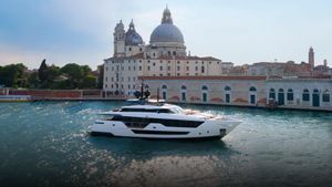 Custom Line 106 Luxury yacht Custom Line 106, 2024 model, cruising near historic architecture.