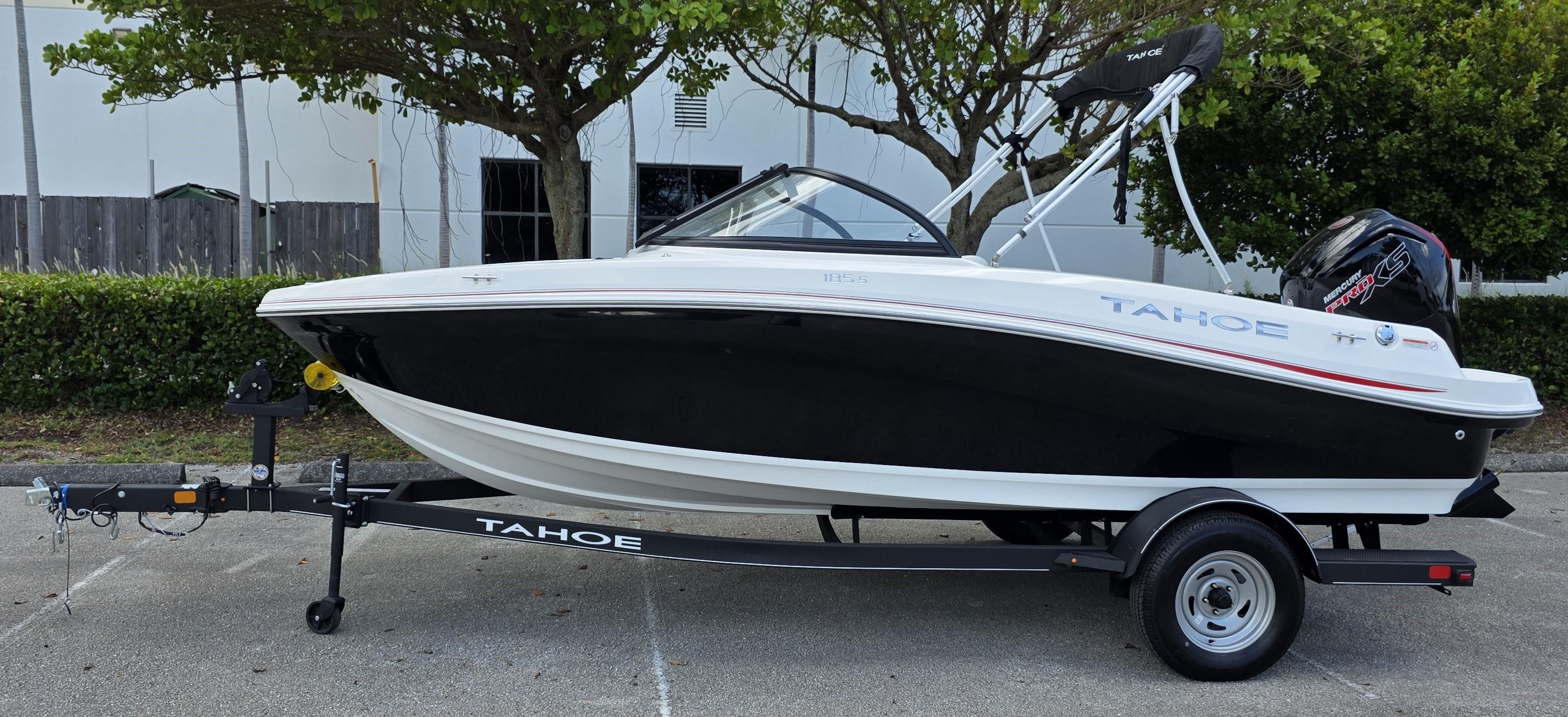 Tahoe 185 S 2024 Tahoe 185 S boat on trailer, black and white design, parked outdoors.