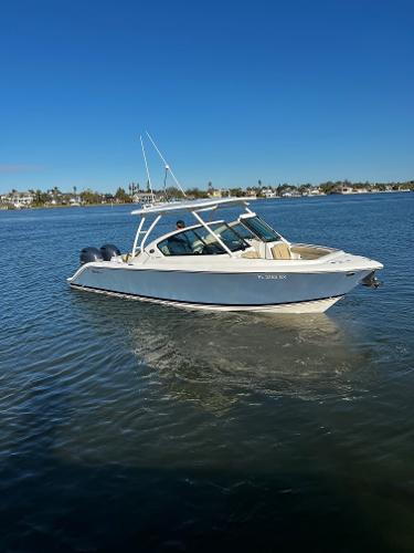Pursuit DC 266 Dual Console 2021 Pursuit DC 266 Dual Console boat on calm water.