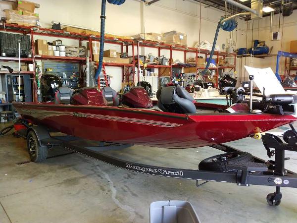 Ranger RT188P 2024 Ranger RT188P boat in a workshop, red color, on a trailer.