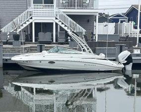 Crownline Eclipse E24 XS 2018 Crownline Eclipse E24 XS boat docked by a waterfront home.