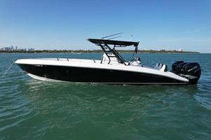 Midnight Express 34' Open 2009 Midnight Express 34' Open boat on calm water, side view.