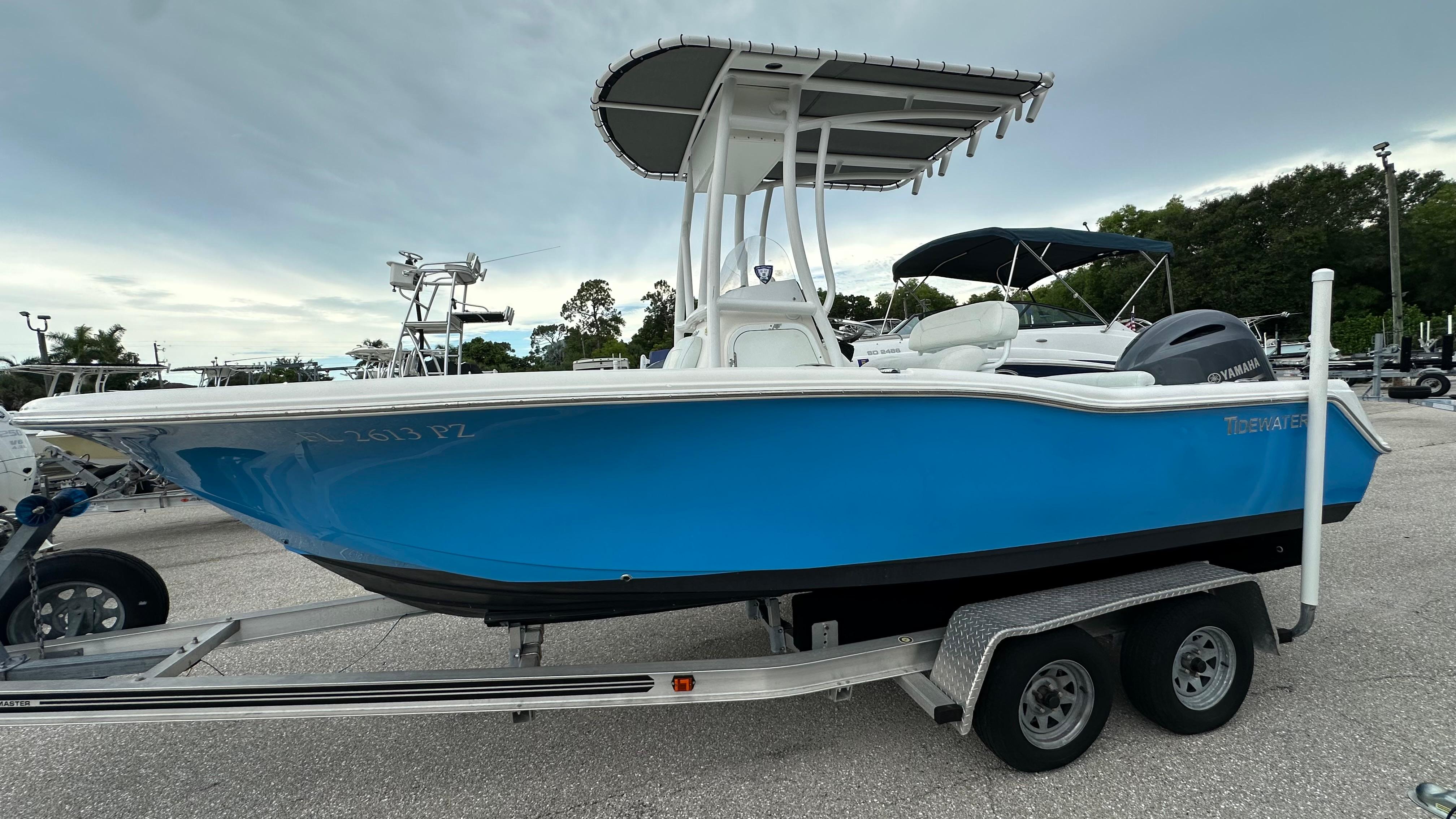 Tidewater 210 CC Adventure 2018 Tidewater 210 CC Adventure boat on trailer, blue hull, parked outdoors.