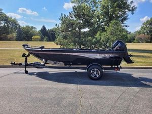 Ranger VS1665T 2024 Ranger VS1665T boat on trailer, parked outdoors on a sunny day.