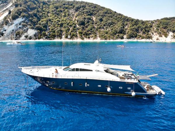 Tecnomar Velvet 90 Tecnomar Velvet 90 yacht, 2011 model, cruising in clear blue waters near a lush coastline.