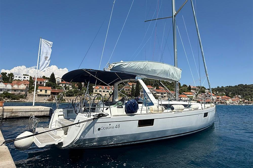 Beneteau Oceanis 48 2017 Beneteau Oceanis 48 yacht docked in a scenic harbor.