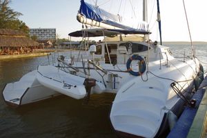 Fountaine Pajot Bahia 46 2004 Fountaine Pajot Bahia 46 catamaran docked at a scenic marina.
