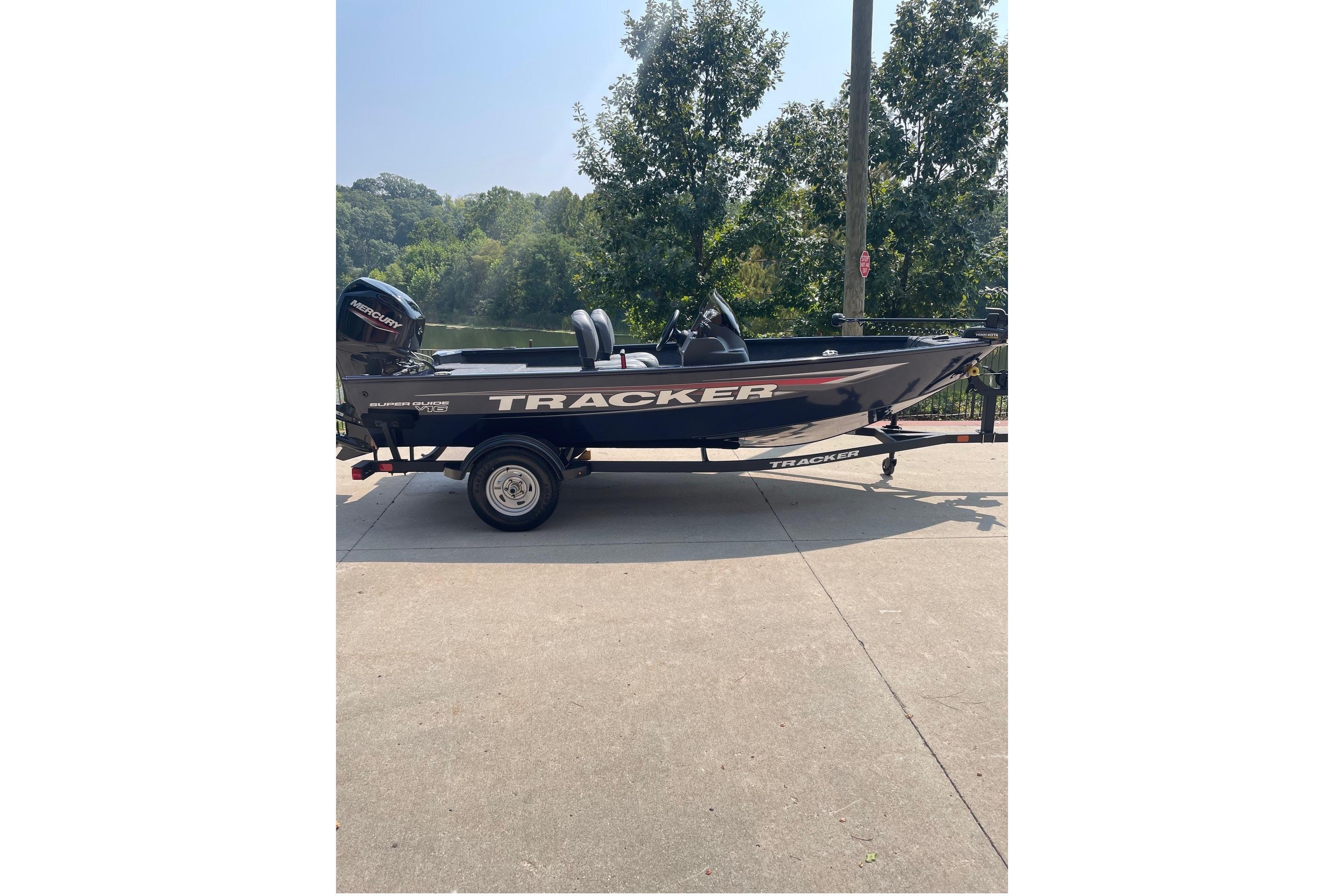 Tracker Super Guide V-16 SC 2026 Tracker Super Guide V-16 SC boat on trailer, parked outdoors.