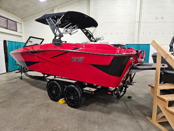 Heyday H22 2024 Heyday H22 boat in vibrant red with black accents on a trailer indoors.