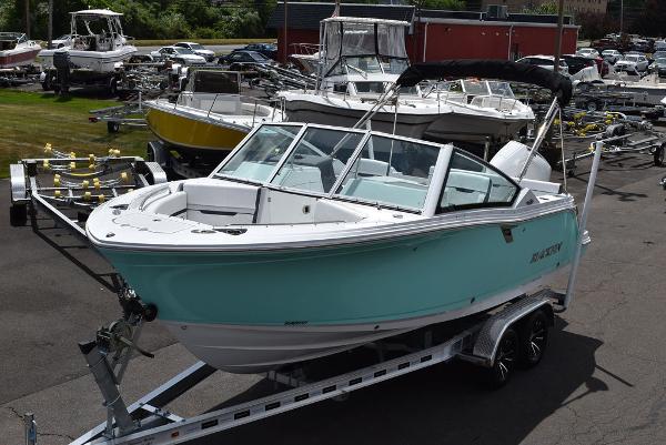 Blackfin 232 DC 2023 Blackfin 232 DC boat on a trailer in a marina.