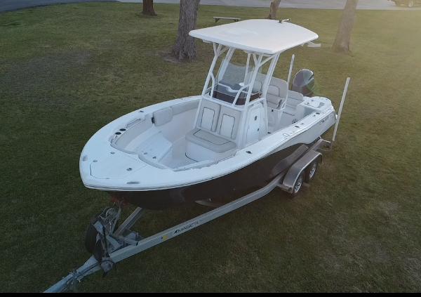 Sea Fox 228 Commander 2021 Sea Fox 228 Commander boat on trailer, parked on grass.