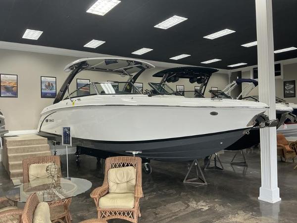 Cobalt R30 2025 Cobalt R30 boat displayed in a showroom with wicker furniture.