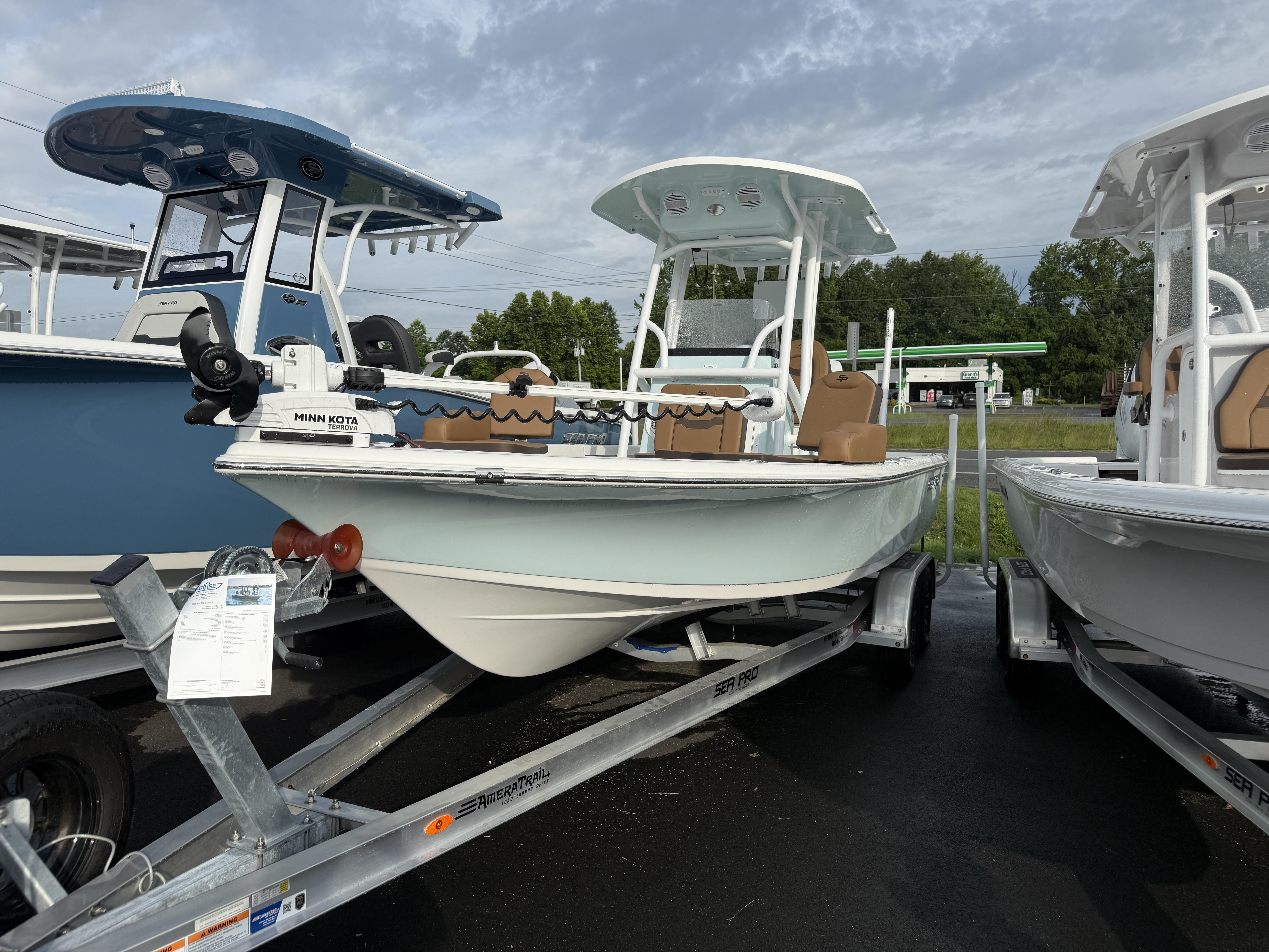 Sea Pro 230 Bay 2025 Sea Pro 230 Bay boat on trailer, featuring Minn Kota trolling motor.