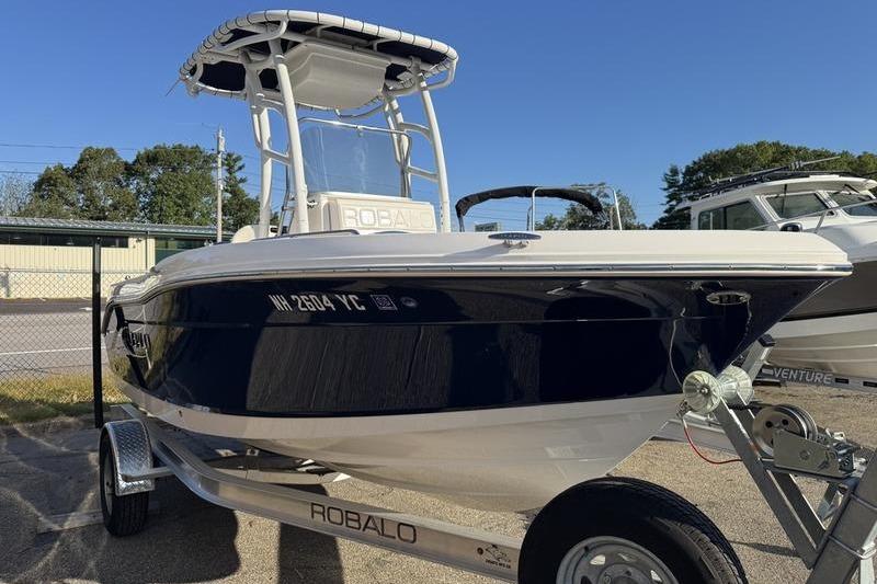 Robalo R180 Center Console 2024 Robalo R180 Center Console boat on trailer, parked outdoors.