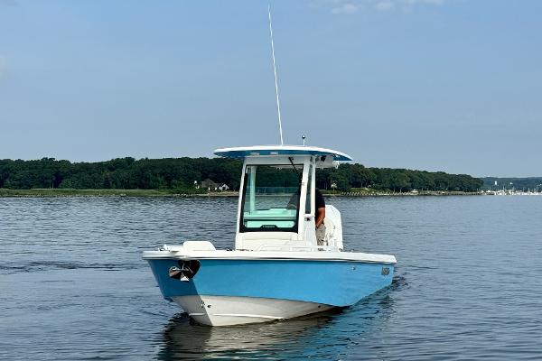 Everglades 253 Center Console 2024 Everglades 253 Center Console boat on calm water.