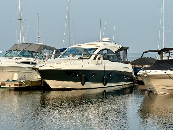 Beneteau Gran Turismo 34 2013 Beneteau Gran Turismo 34 yacht docked at marina, surrounded by other boats.