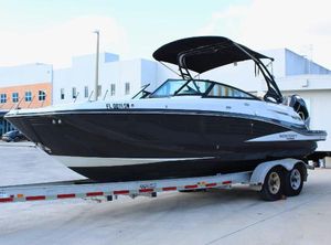 Monterey M-65 2021 Monterey M65 boat on trailer, black and white design, parked outdoors.