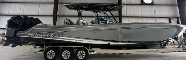 Nor-Tech 390 Sport 2024 Nor-Tech 390 Sport boat on trailer in indoor storage facility.