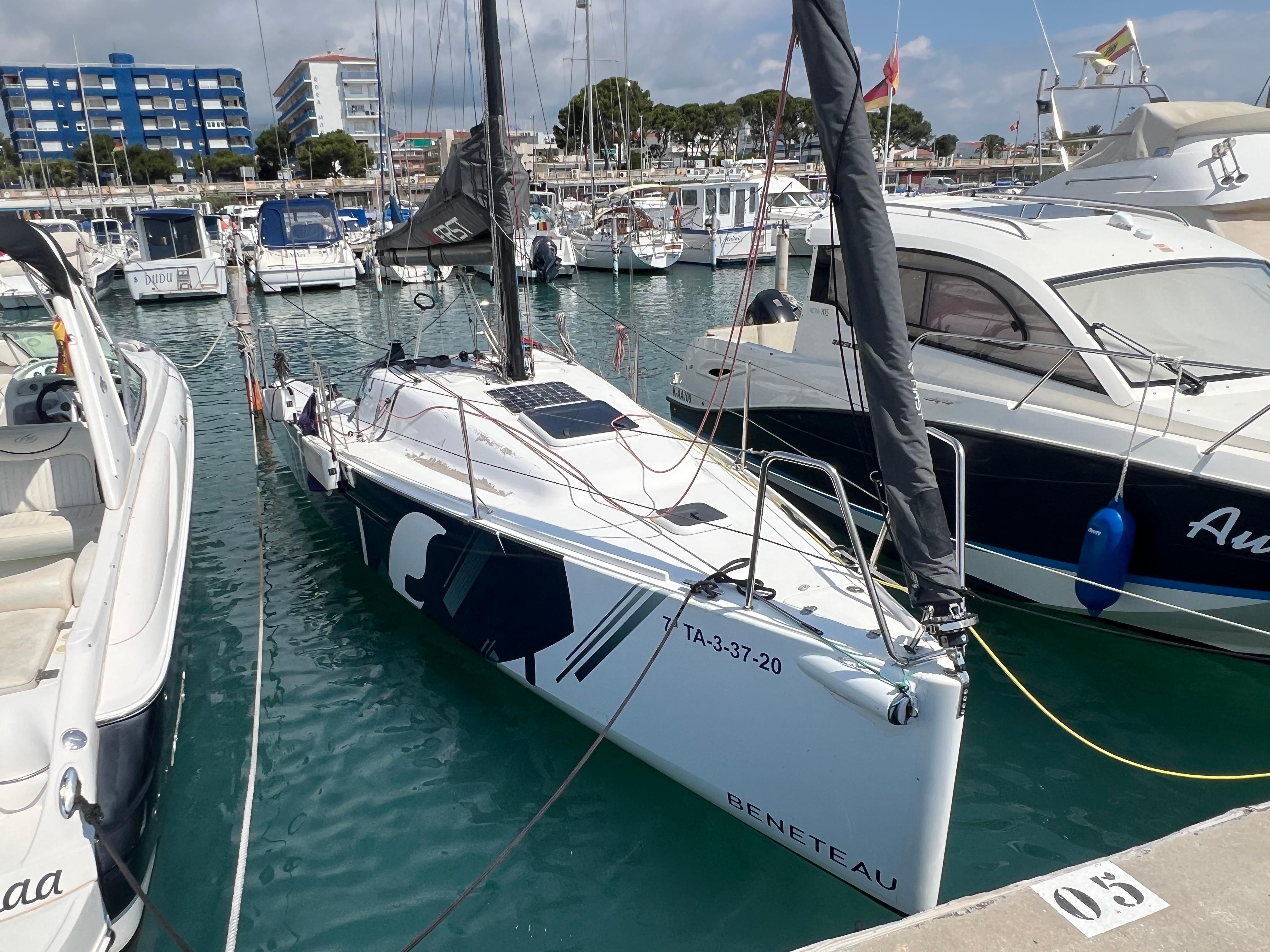 Beneteau First 27 2019 Beneteau First 27 sailboat docked in a marina, surrounded by other boats.