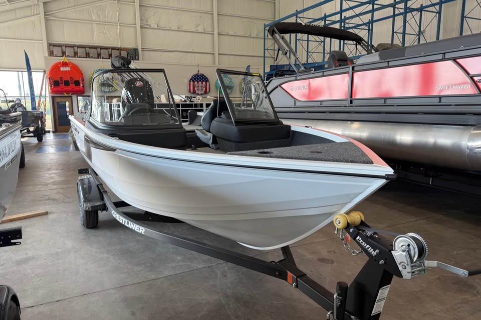 Crestliner 1750 hawk wt j 2026 Crestliner 1750 Hawk WT J boat in showroom, on trailer, side view.