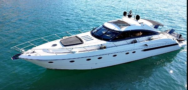 Princess V65 Luxury 2001 Princess V65 yacht cruising on clear blue water.