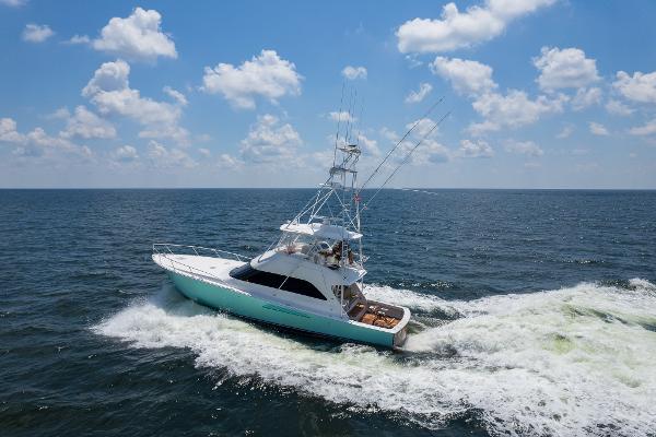 Viking 54 Sport Fisher 2008 Viking 54 Sport Fisher yacht cruising on open water under a blue sky.