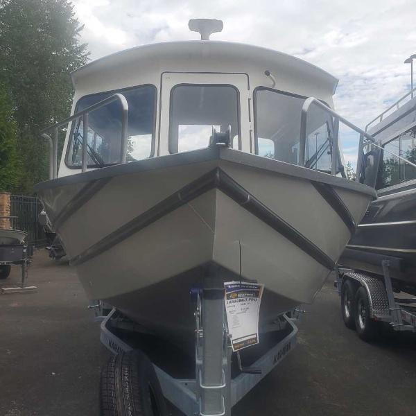 Spartan 240 Maximus Pro 2024 Spartan 240 Maximus Pro boat on trailer, front view, outdoors.