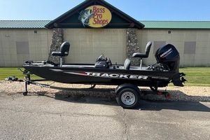 Tracker Pro 170 2026 Tracker Pro 170 boat outside Bass Pro Shops, featuring a Mercury engine.