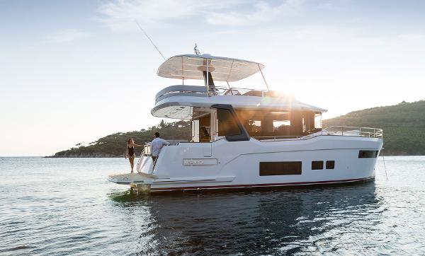 Sirena 48 Modern Sirena 48 yacht on serene water, 2025 model, with people enjoying the sunset.