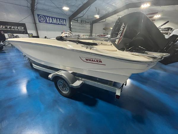 Boston Whaler 160 Super Sport 2025 Boston Whaler 160 Super Sport boat on trailer in showroom.