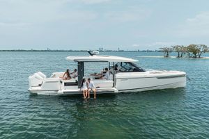 Saxdor 400 GTO 2026 Saxdor 400 GTO yacht on water with people relaxing onboard.